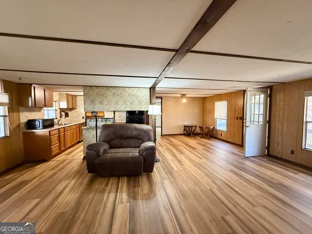 a view of livingroom with furniture wooden floor and window