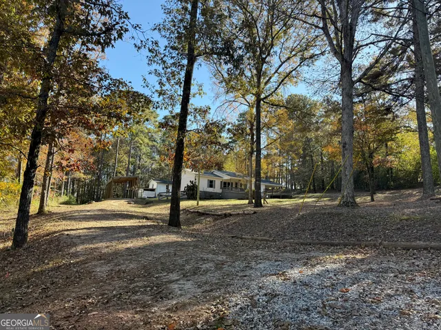 a bench sitting in the middle of a yard