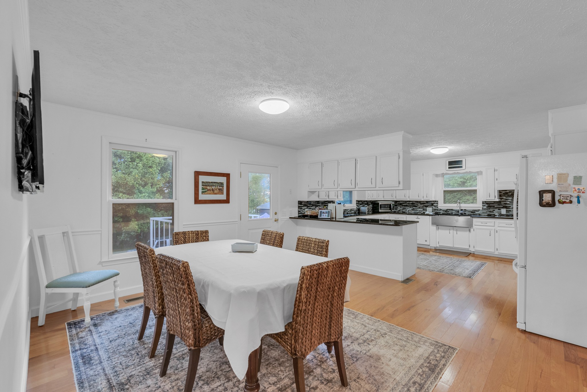 1389 Coconut Ridge Road Smithville, TN 37166 - Photo 15 of 39 a view of a dining room with furniture and wooden floor