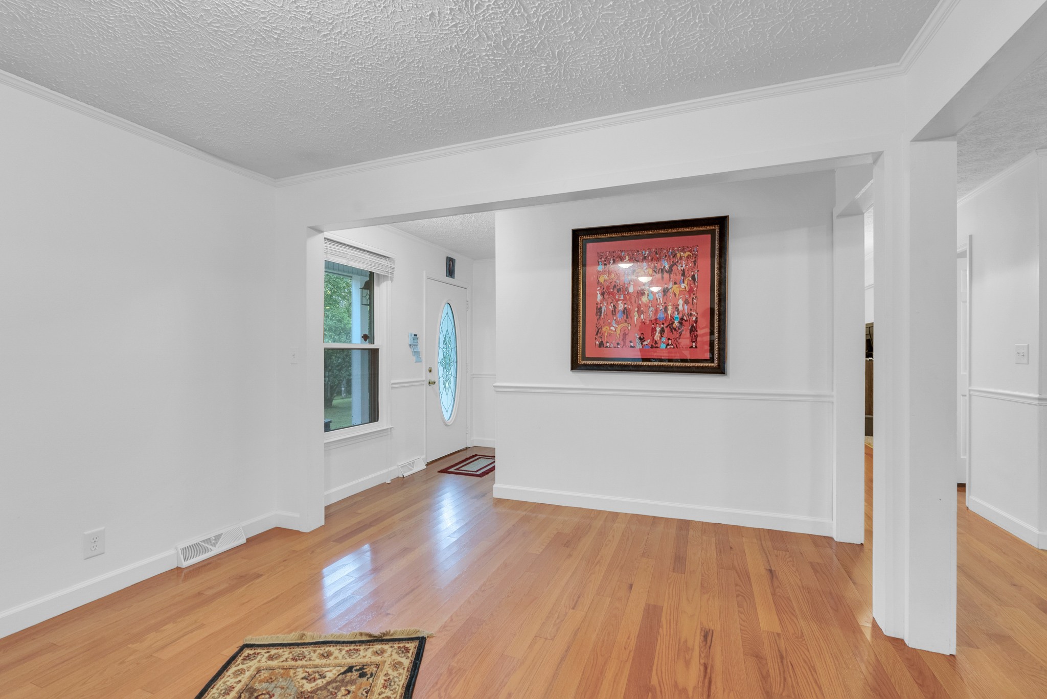 1389 Coconut Ridge Road Smithville, TN 37166 - Photo 19 of 39 an empty room with wooden floor and windows