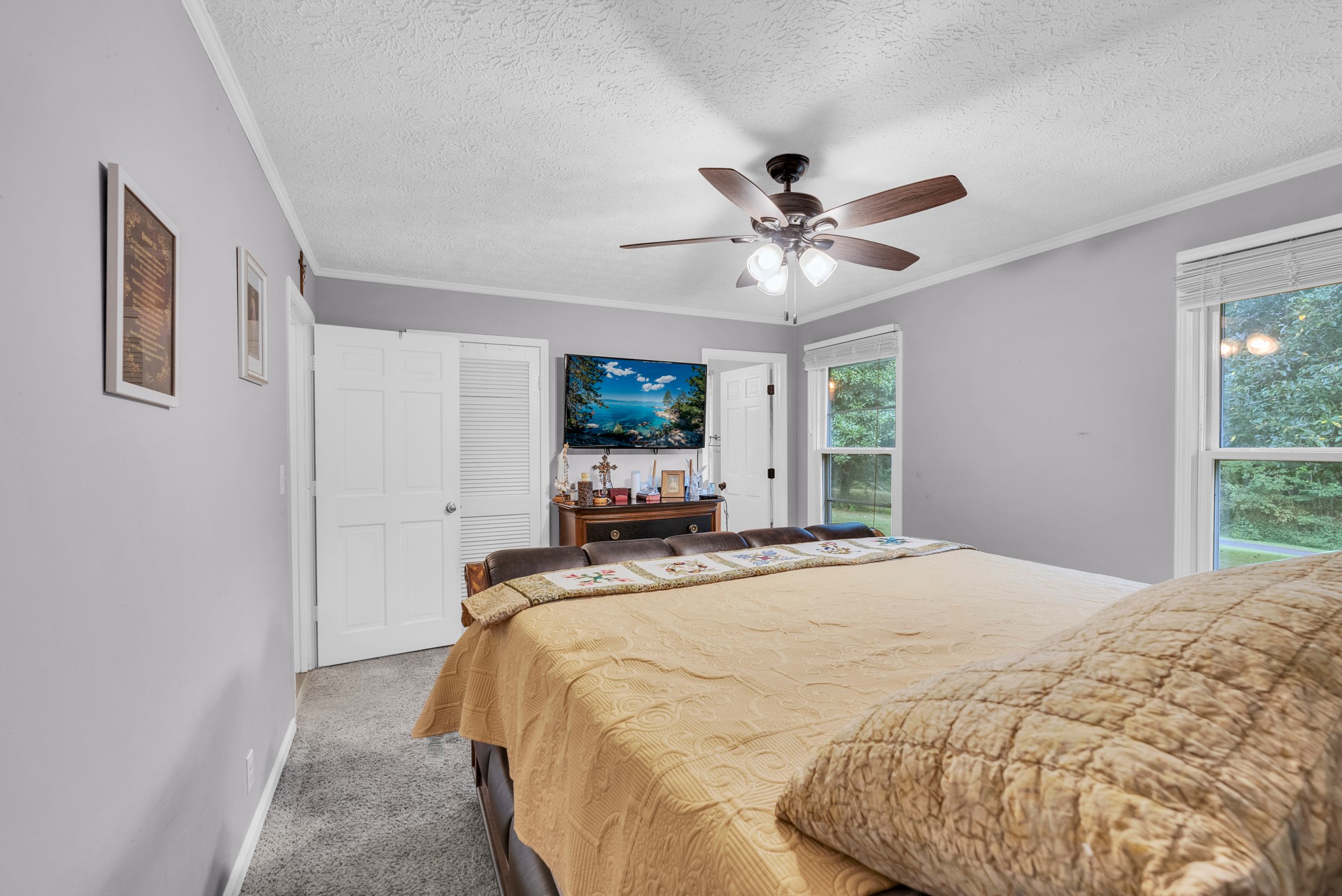 1389 Coconut Ridge Road Smithville, TN 37166 - Photo 21 of 39 a bed sitting in a spacious bedroom next to a window
