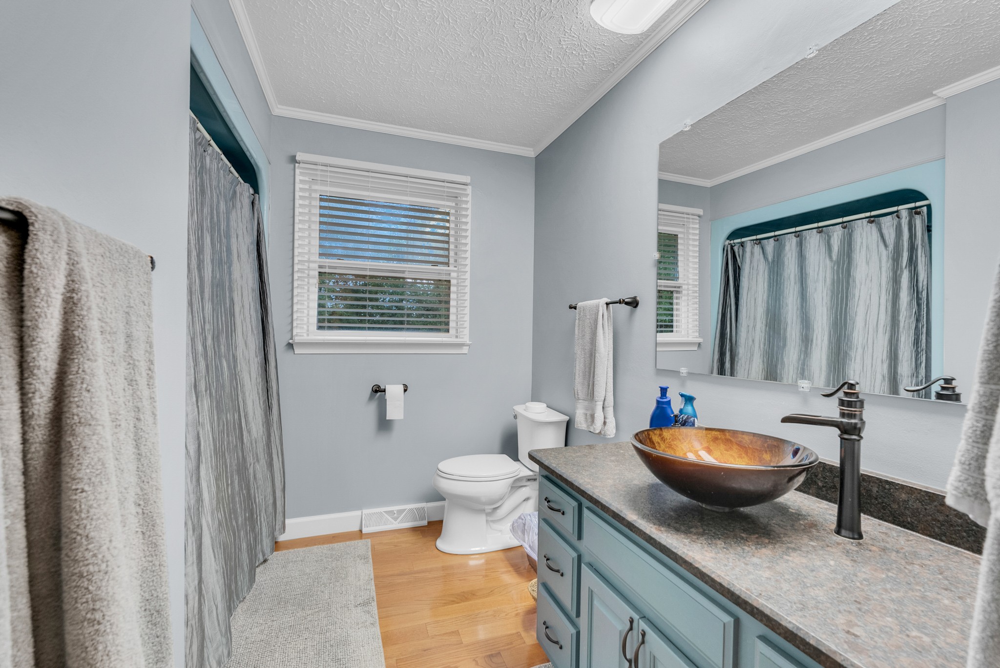 1389 Coconut Ridge Road Smithville, TN 37166 - Photo 25 of 39 a bathroom with a granite countertop sink and a mirror