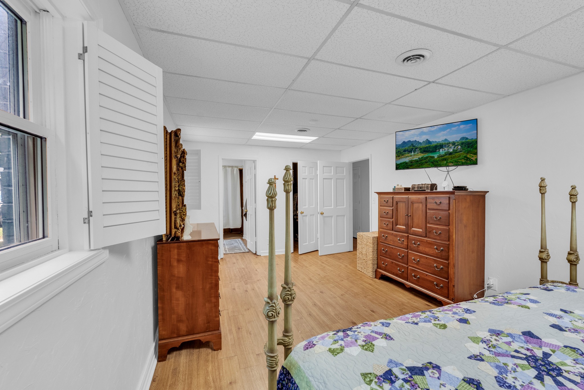 1389 Coconut Ridge Road Smithville, TN 37166 - Photo 31 of 39 a bedroom with a bed and a flat screen tv