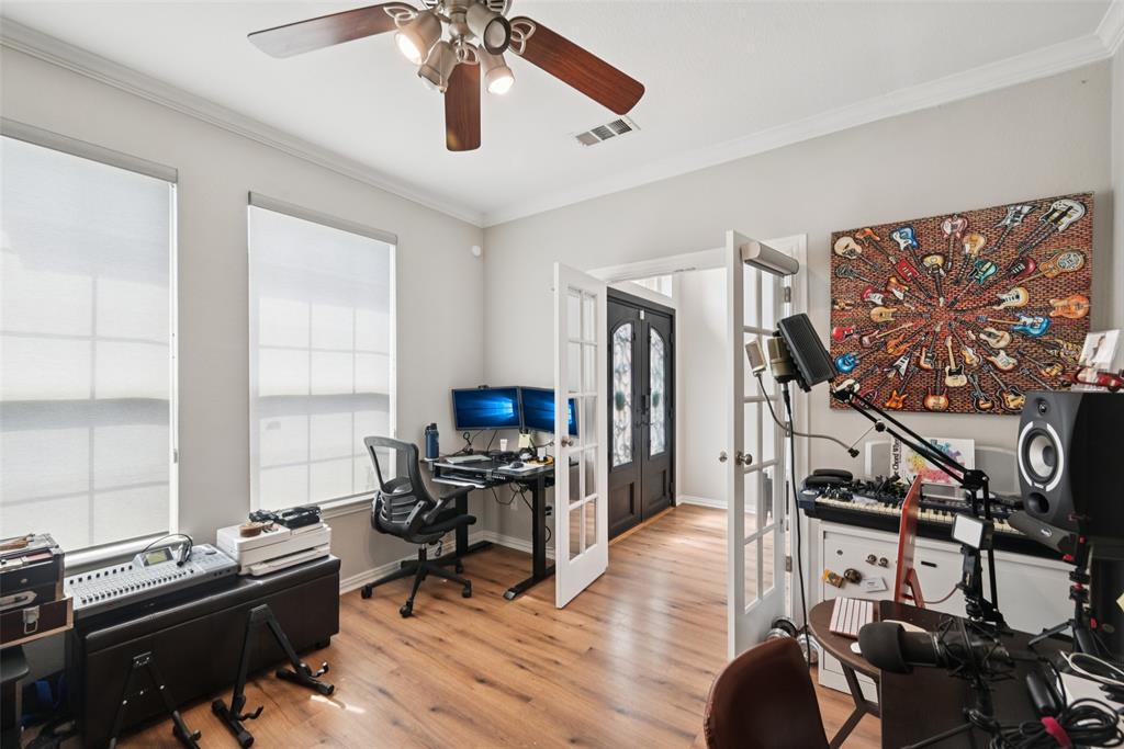 1321 Shell Beach Drive Little Elm, TX 75068 - Photo 15 of 40 a work room with furniture and wooden floor