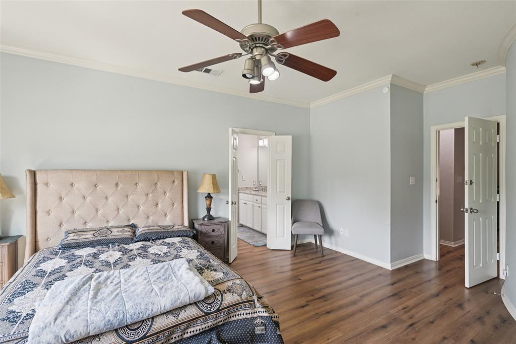 1321 Shell Beach Drive Little Elm, TX 75068 - Photo 17 of 40 a bedroom with a bed and a large window