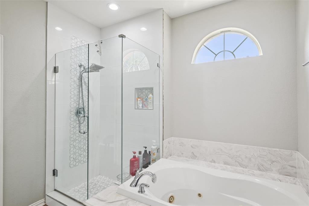 1321 Shell Beach Drive Little Elm, TX 75068 - Photo 20 of 40 a bathroom with a tub and a shower