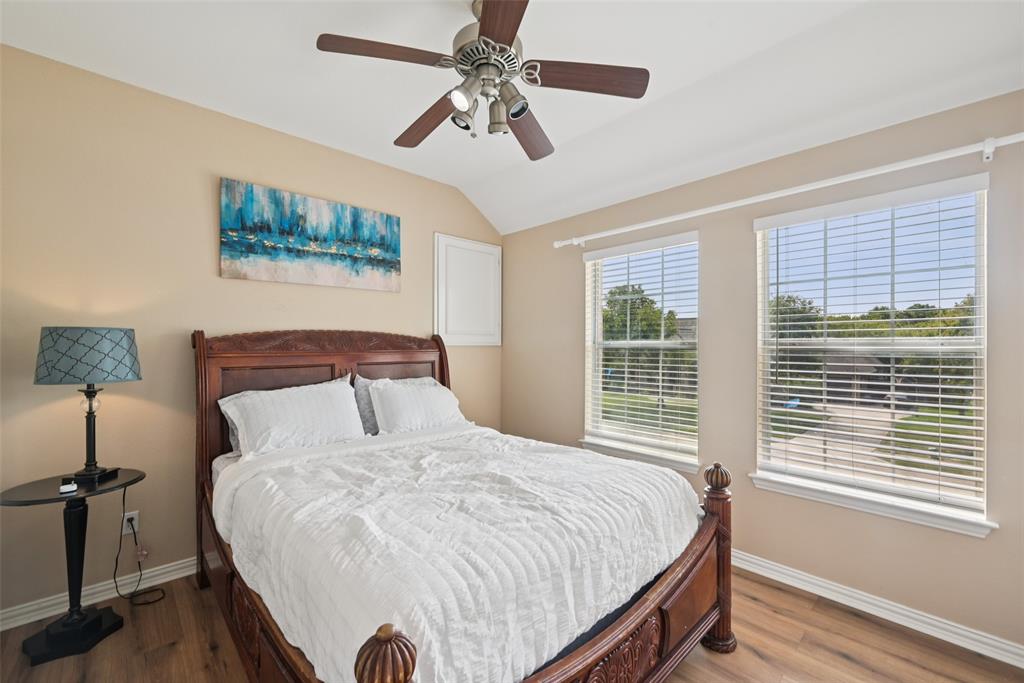 1321 Shell Beach Drive Little Elm, TX 75068 - Photo 25 of 40 a bedroom with a bed and a window