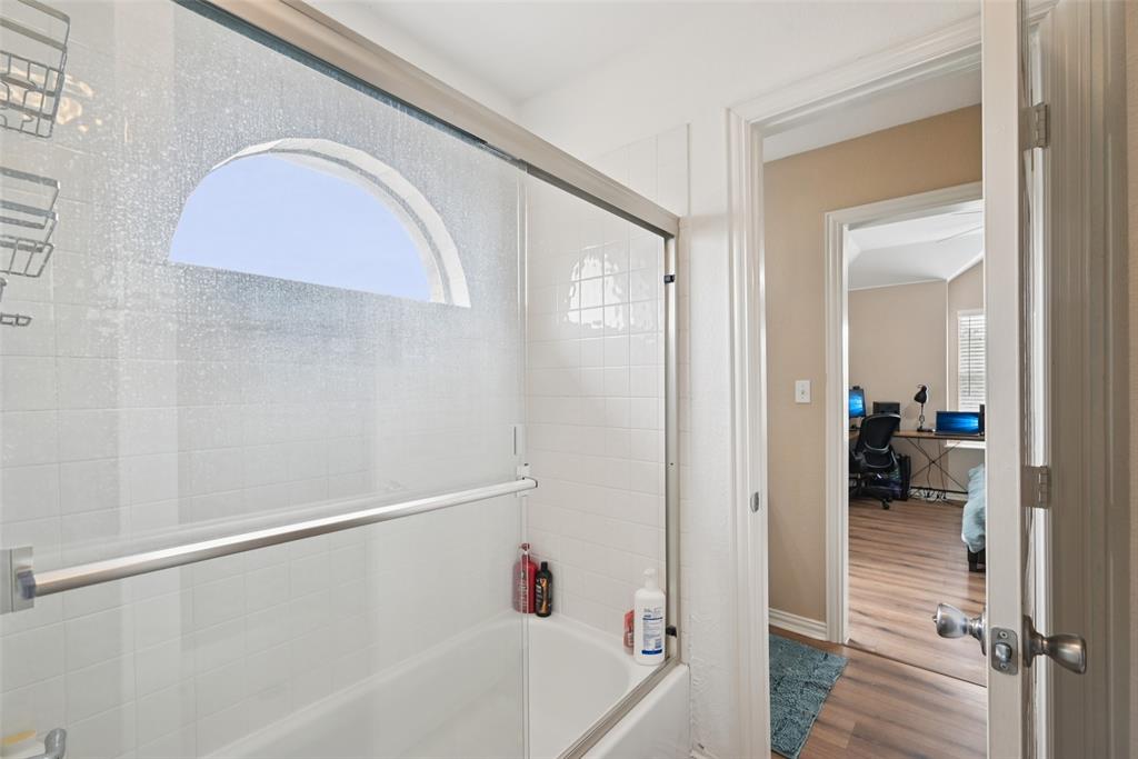 1321 Shell Beach Drive Little Elm, TX 75068 - Photo 29 of 40 a bathroom with a bathtub and a shower