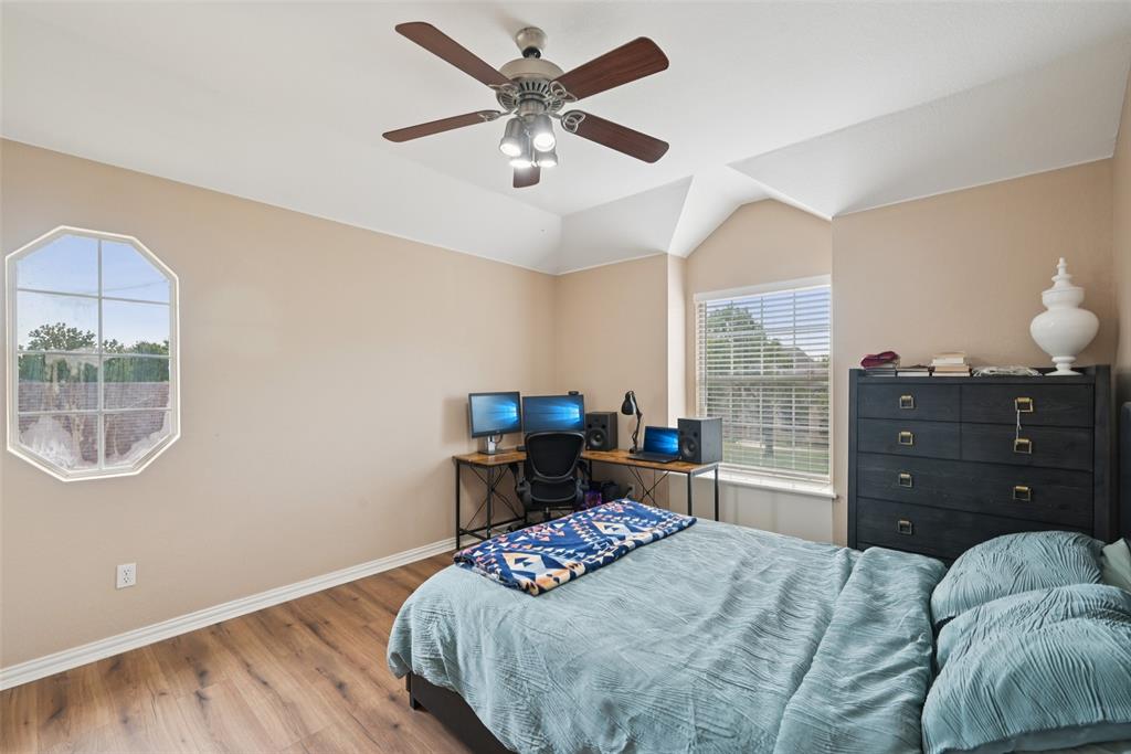 1321 Shell Beach Drive Little Elm, TX 75068 - Photo 30 of 40 a bedroom with a bed and window