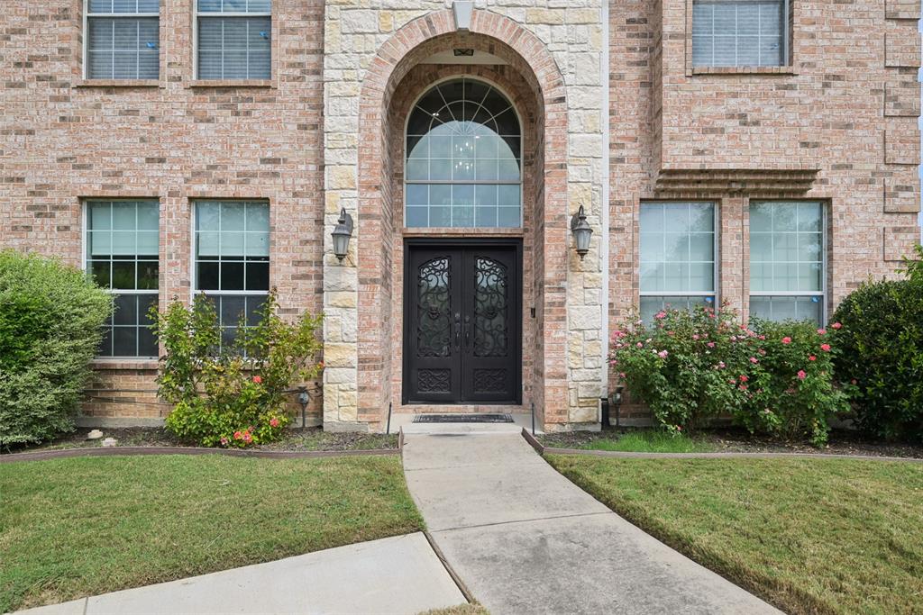 1321 Shell Beach Drive Little Elm, TX 75068 - Photo 3 of 40 a front view of a house with garden