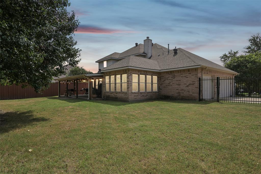 1321 Shell Beach Drive Little Elm, TX 75068 - Photo 37 of 40 a front view of a house with garden