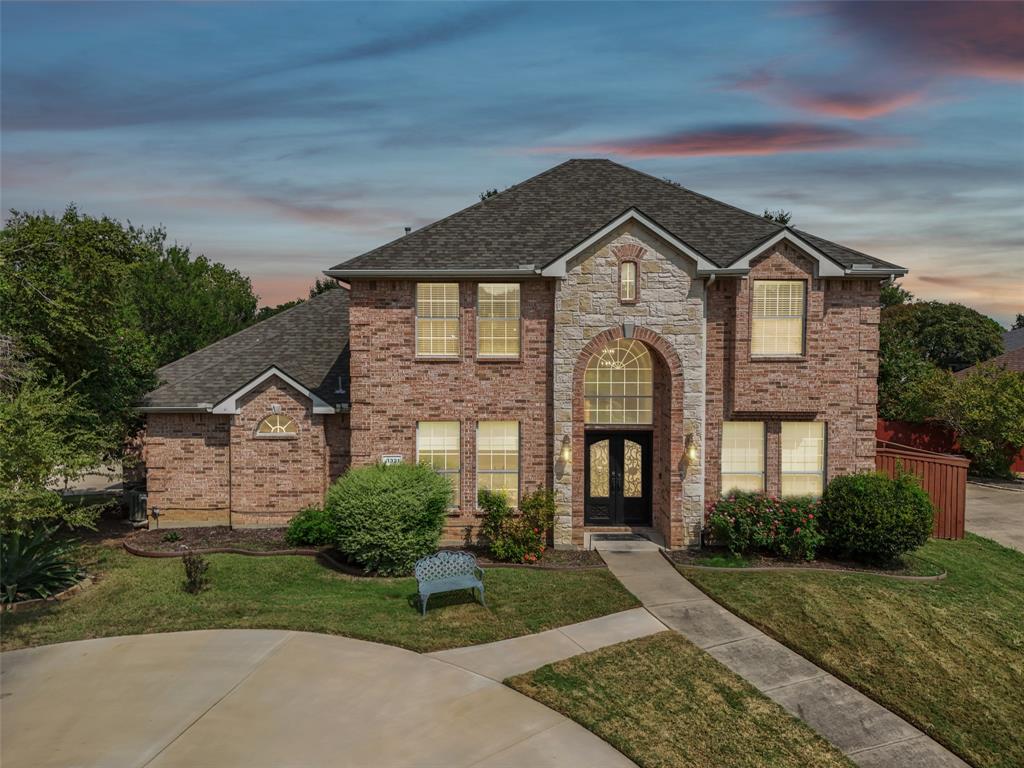 1321 Shell Beach Drive Little Elm, TX 75068 - Photo 4 of 40 a front view of a house with garden