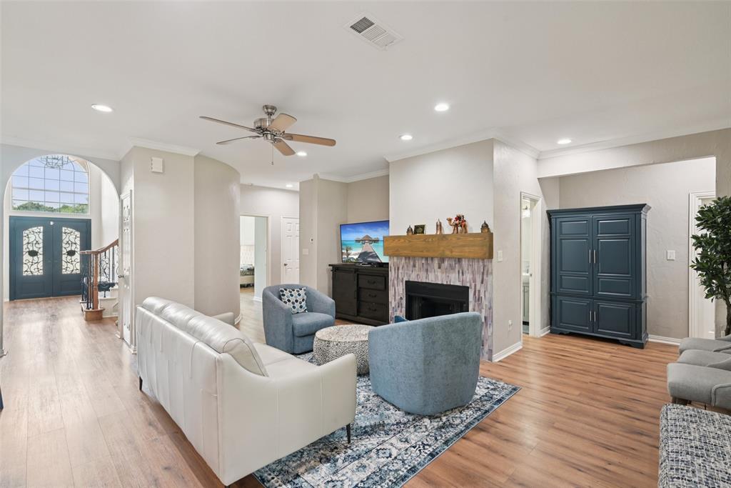 1321 Shell Beach Drive Little Elm, TX 75068 - Photo 6 of 40 a living room with furniture and a fireplace