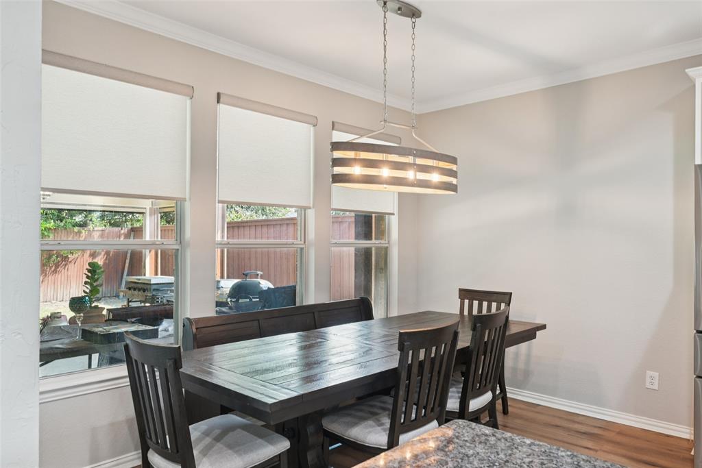 1321 Shell Beach Drive Little Elm, TX 75068 - Photo 8 of 40 a view of a dining room with furniture window and wooden floor