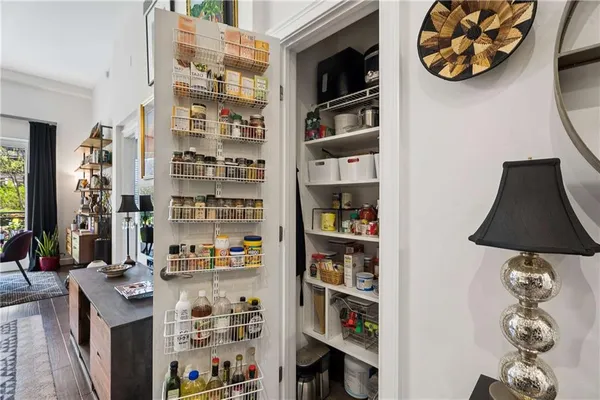 walk in closet with book shelf and book shelf