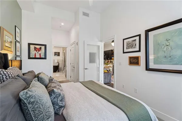 a bedroom with a bed and a couch