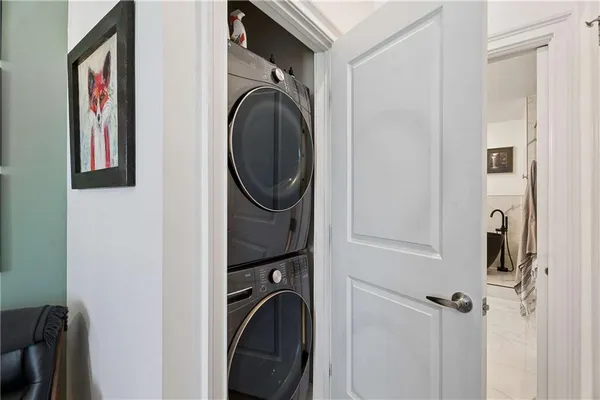 a close view of a utility room with dryer and washer