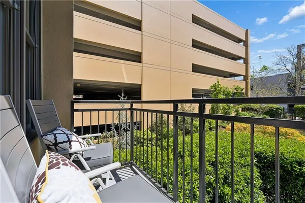 a view of balcony with furniture