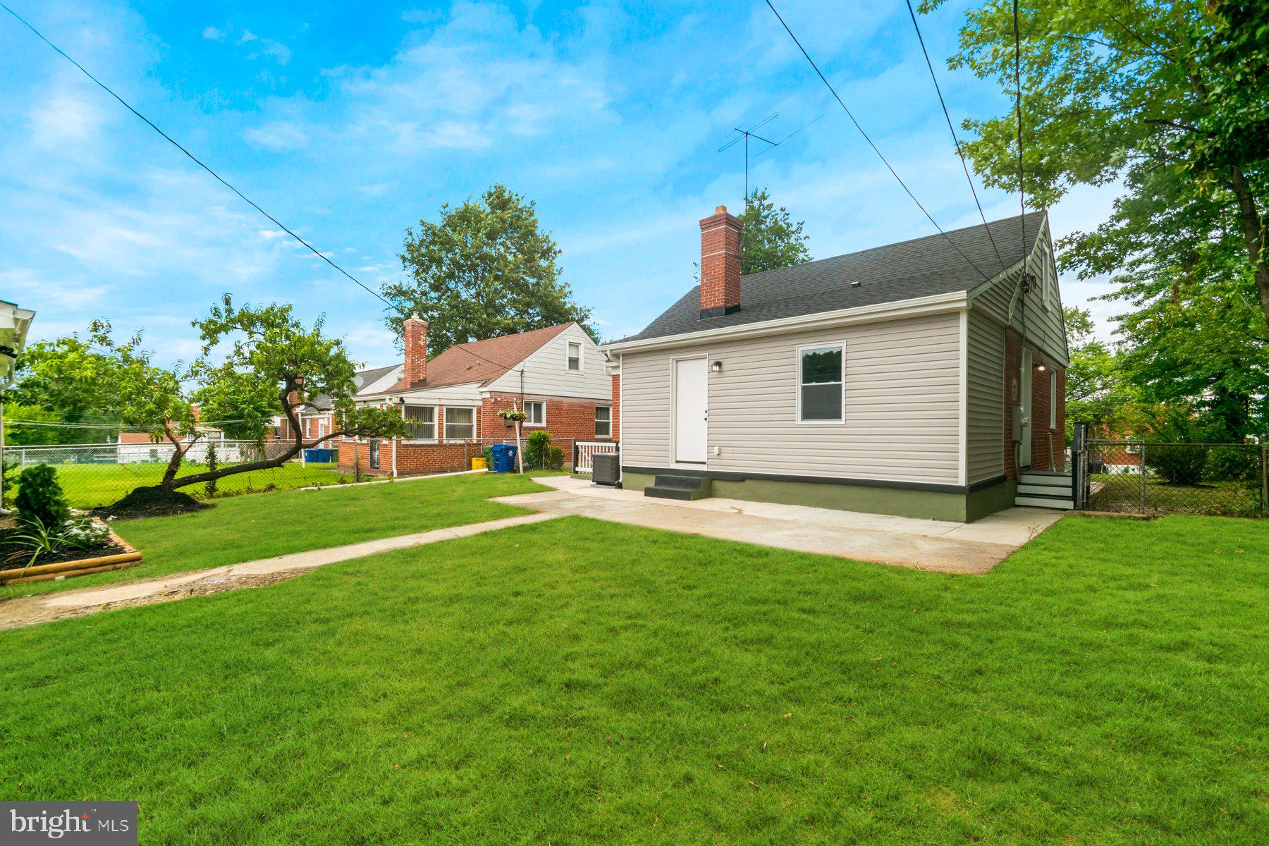 5302 The Alameda Baltimore, MD 21239 - Photo 29 of 36 a front view of a house with a yard