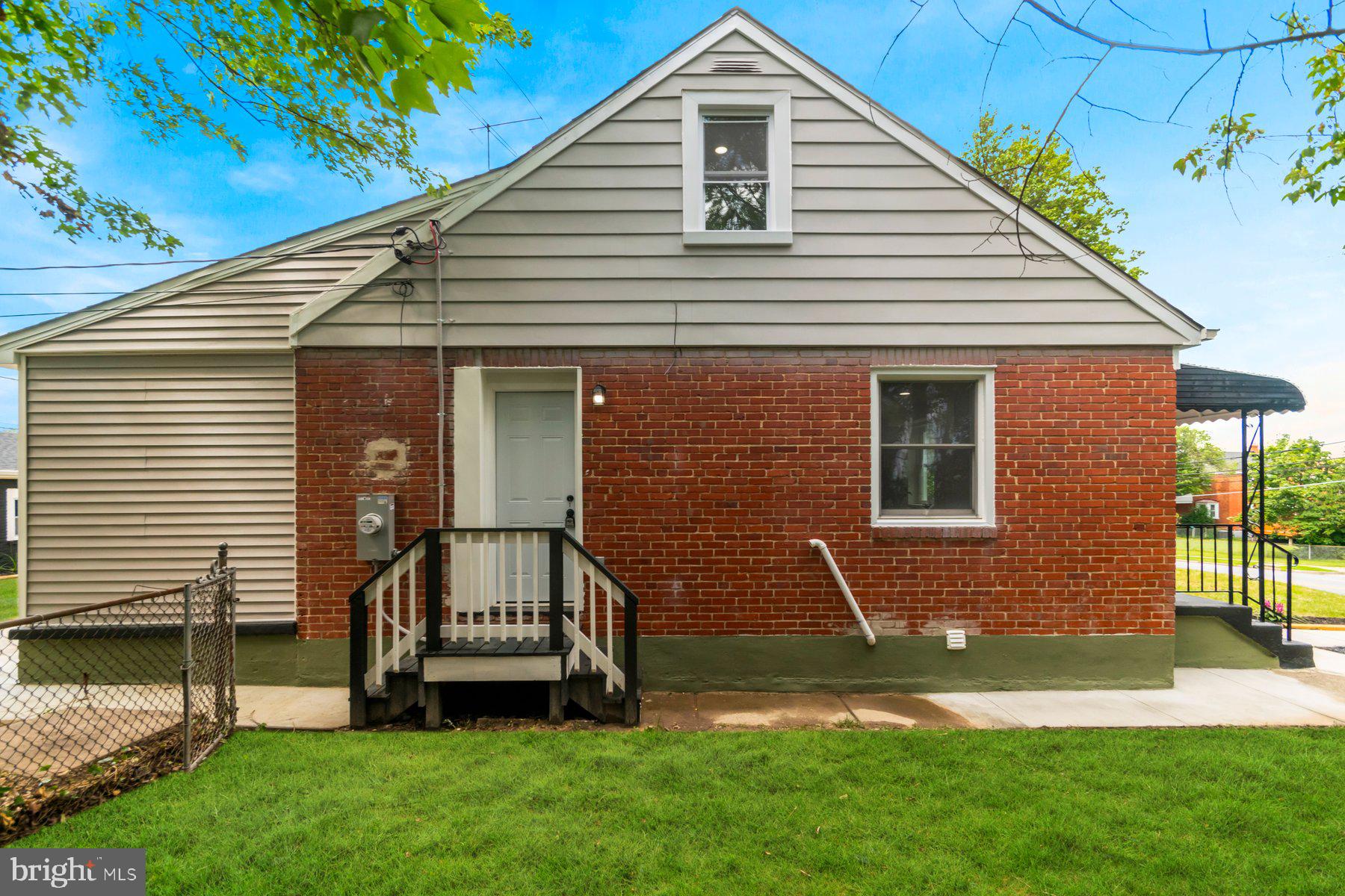5302 The Alameda Baltimore, MD 21239 - Photo 34 of 36 a front view of a house with a yard