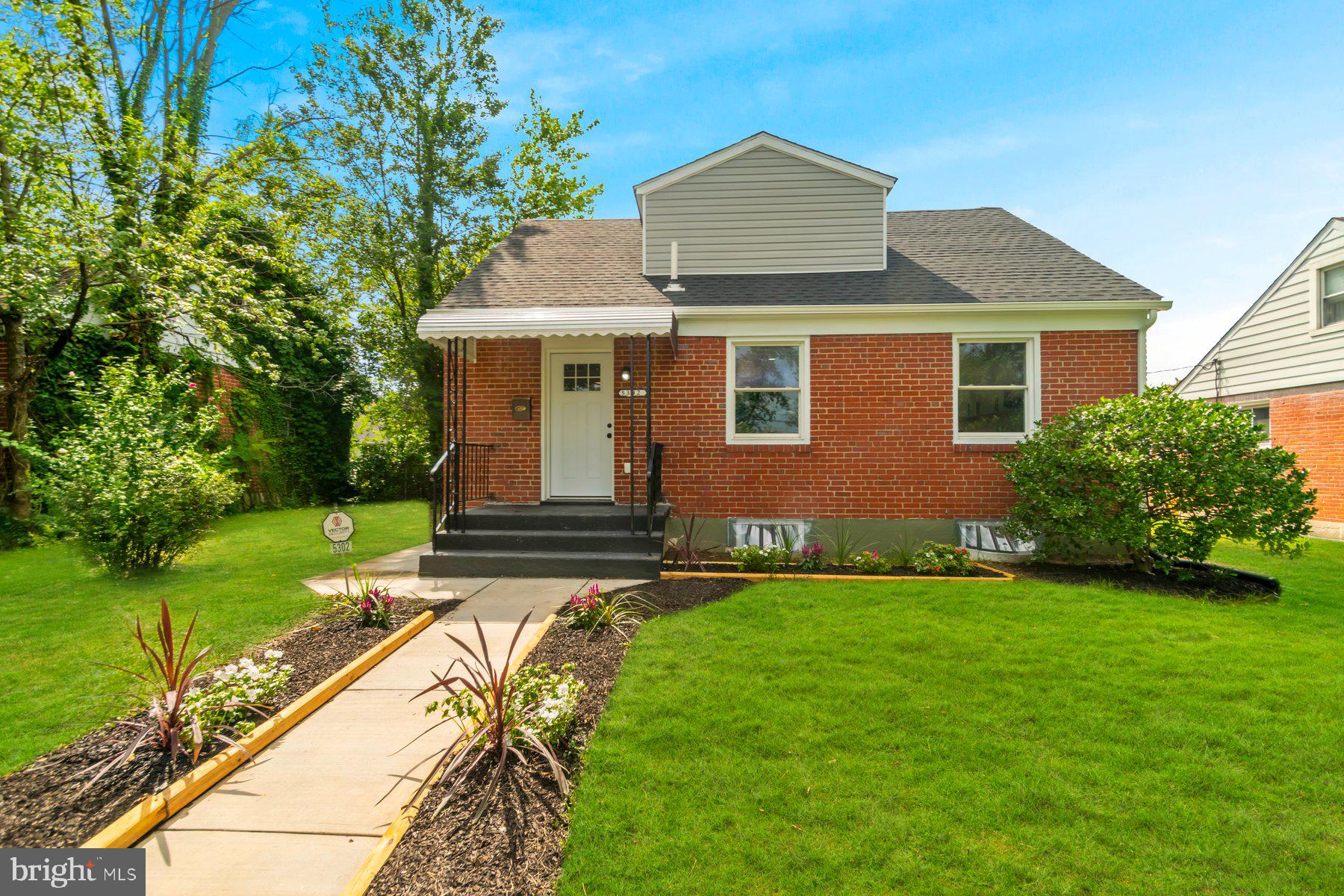 5302 The Alameda Baltimore, MD 21239 - Photo 35 of 36 a front view of a house with garden