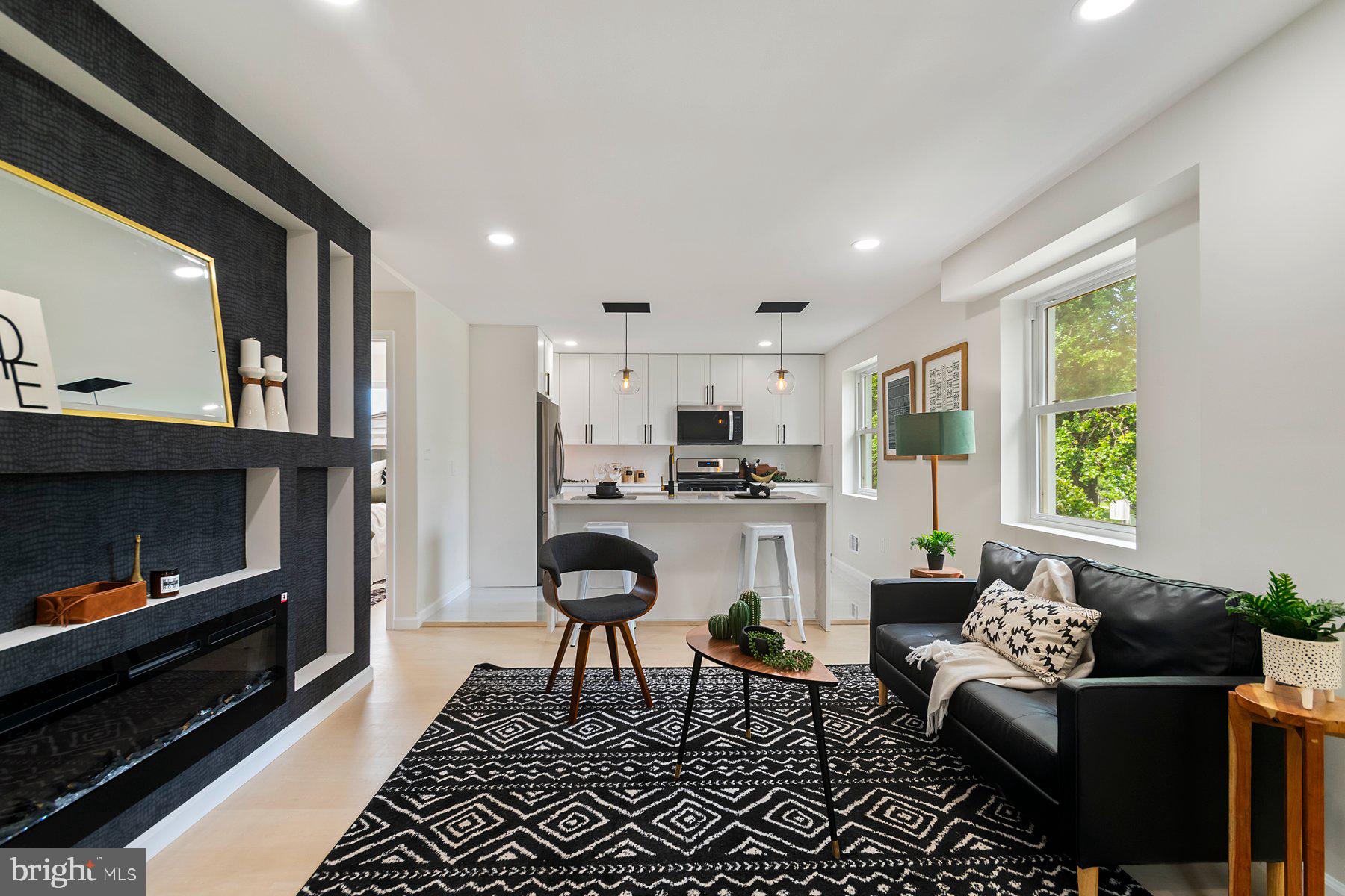 5302 The Alameda Baltimore, MD 21239 - Photo 4 of 36 a living room with furniture and a fireplace