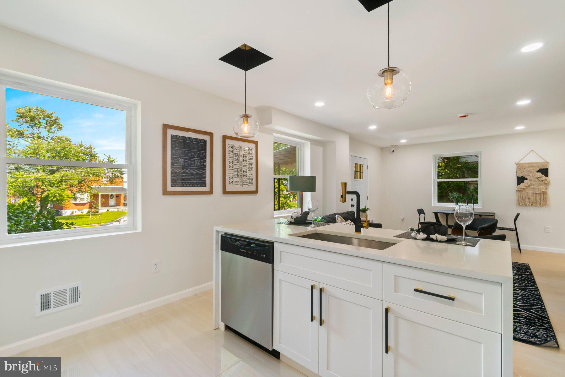 5302 The Alameda Baltimore, MD 21239 - Photo 10 of 36 a kitchen with a sink stainless steel appliances and cabinets