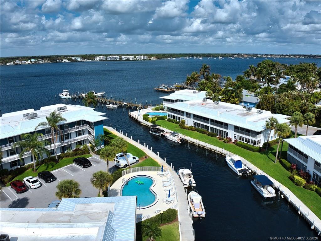 1862 Southwest Palm City Road, Unit 203 Stuart, FL 34994 - Photo 3 of 39 an aerial view of a house with a lake view