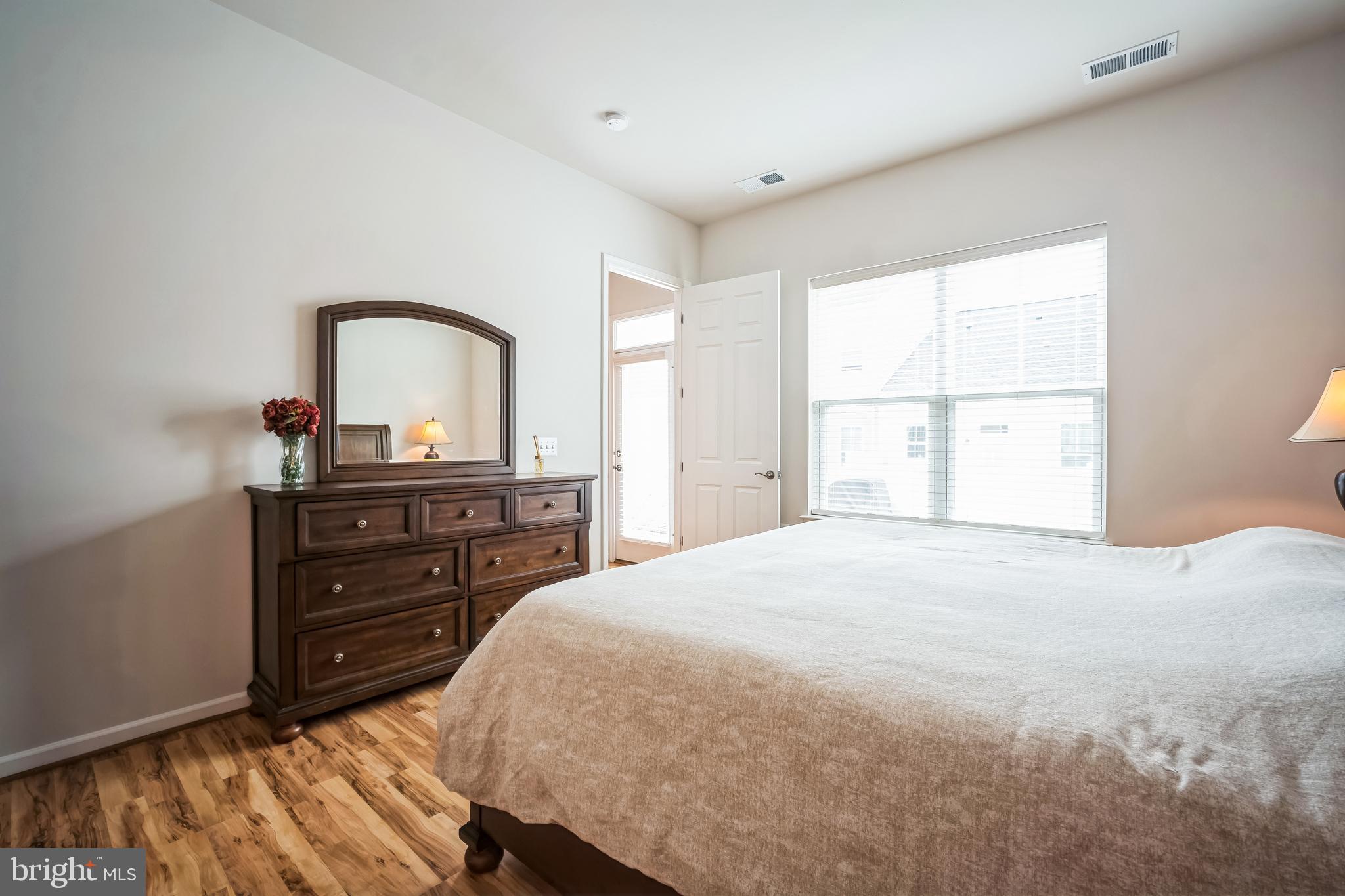 9348 Crestview Rdg Drive Bristow, VA 20136 - Photo 16 of 29 a bedroom with a bed and a dresser
