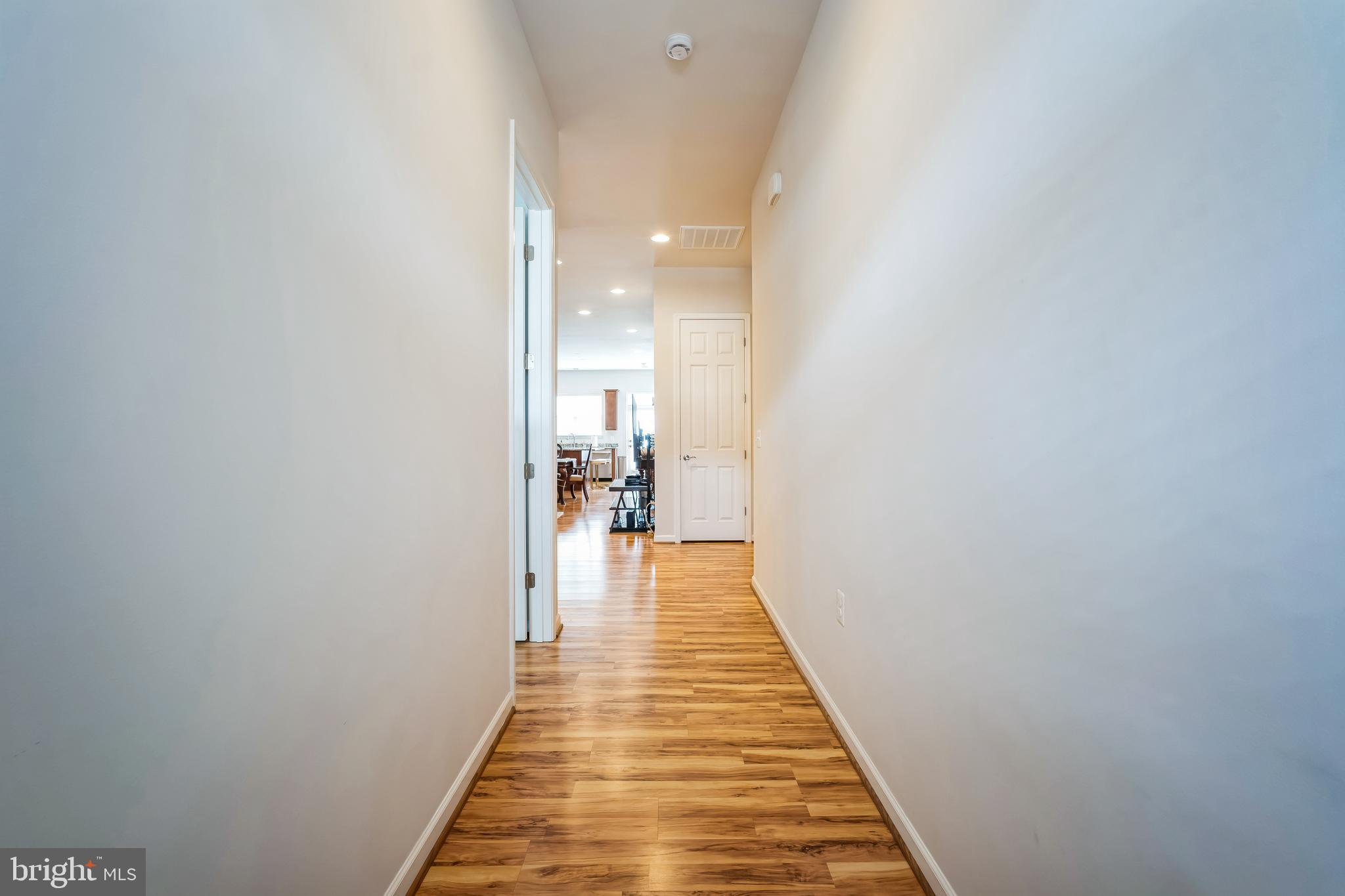 9348 Crestview Rdg Drive Bristow, VA 20136 - Photo 2 of 29 a view of a hallway with wooden floor and staircase
