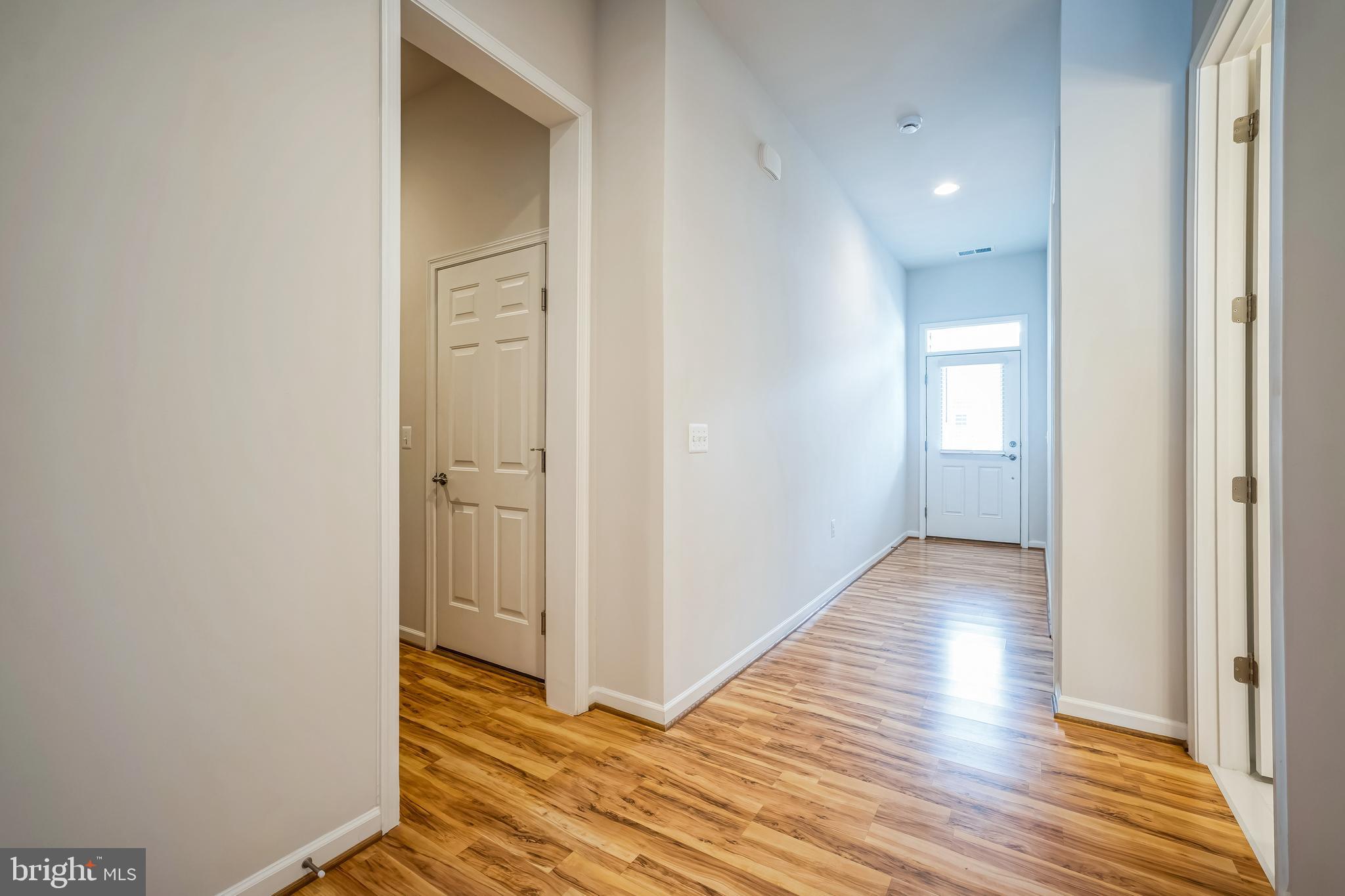 9348 Crestview Rdg Drive Bristow, VA 20136 - Photo 26 of 29 a view of a hallway with wooden floor