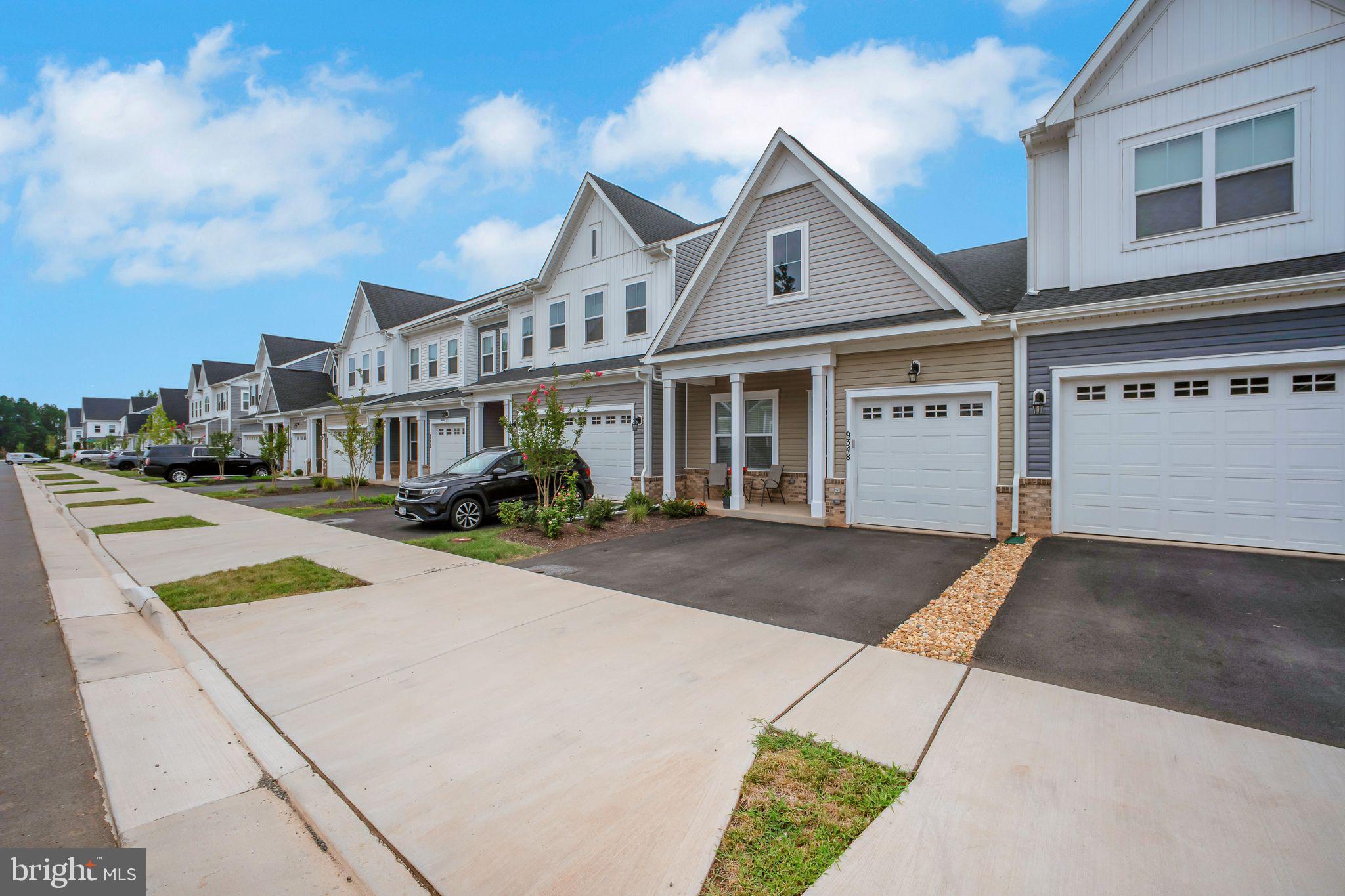 9348 Crestview Rdg Drive Bristow, VA 20136 - Photo 27 of 29 a front view of a house with yard