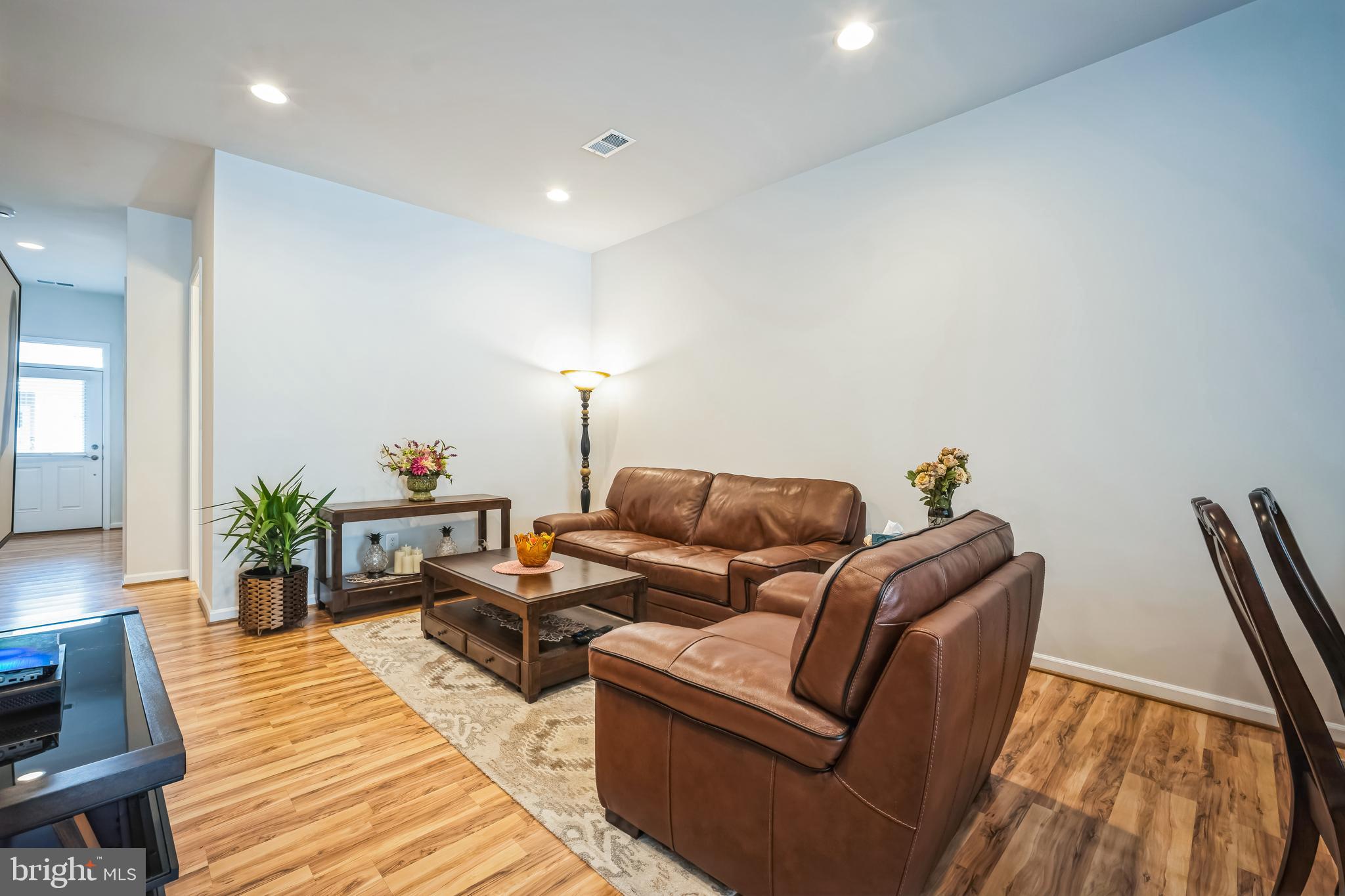 9348 Crestview Rdg Drive Bristow, VA 20136 - Photo 3 of 29 a living room with furniture and wooden floor