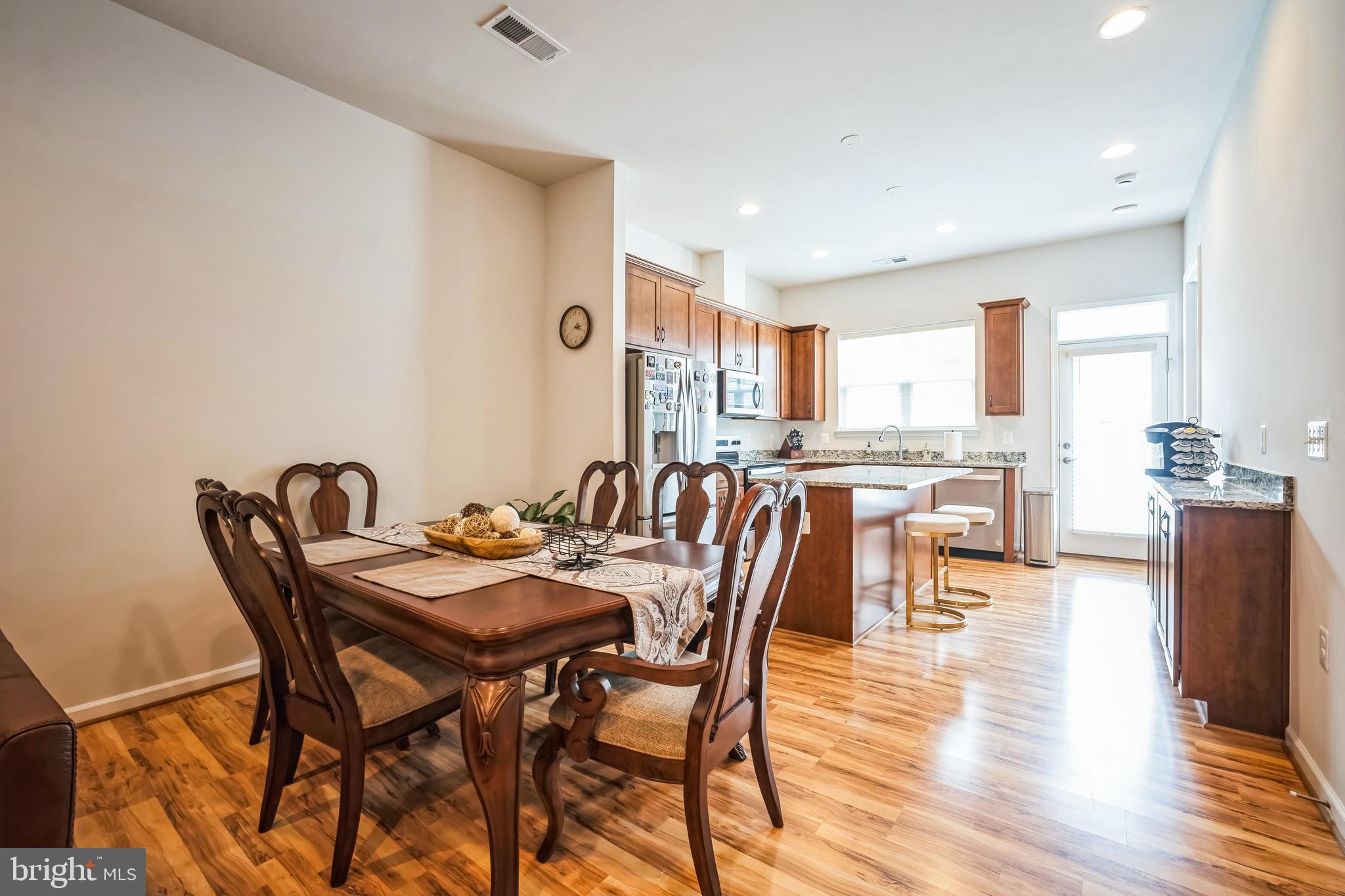9348 Crestview Rdg Drive Bristow, VA 20136 - Photo 8 of 29 a view of a dining room with furniture and wooden floor