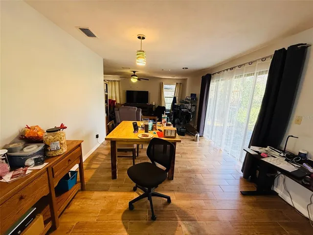 a room with gym equipment and a flat screen tv