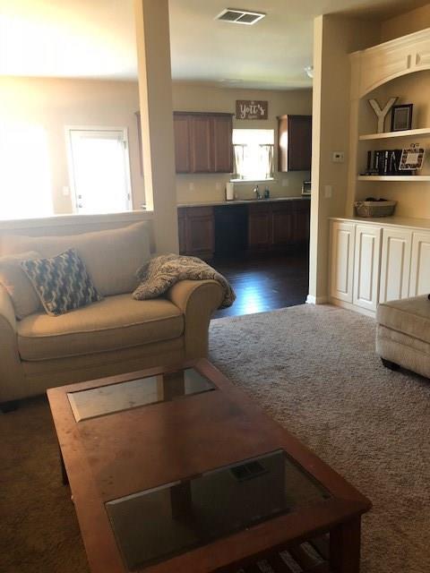 a living room with furniture and window