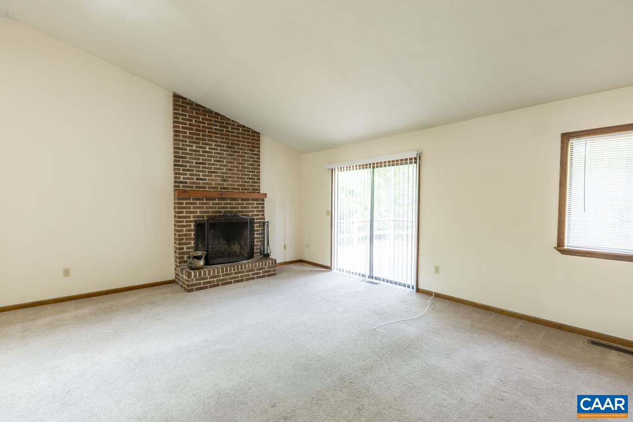 32 Begum Road Palmyra, VA 22963 - Photo 8 of 23 an empty room with a fireplace and window