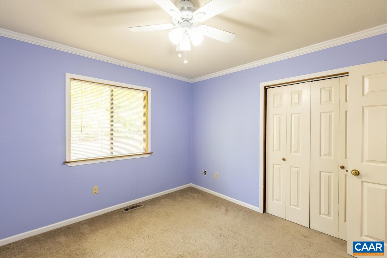 32 Begum Road Palmyra, VA 22963 - Photo 10 of 23 an empty room with a window and a chandelier fan