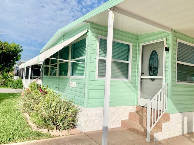 808 South Silver Circle Key Largo, FL 33037 - Photo 3 of 50 a house view with a garden space