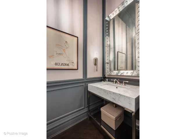 a bedroom with furniture and a large window