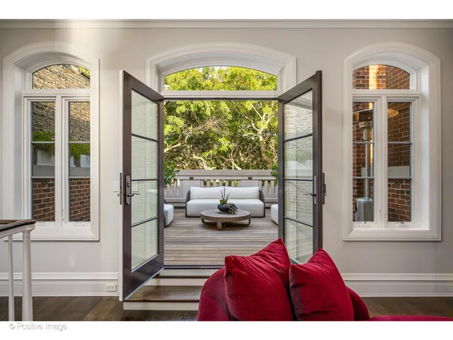 a view of a patio with couches and a table and chairs