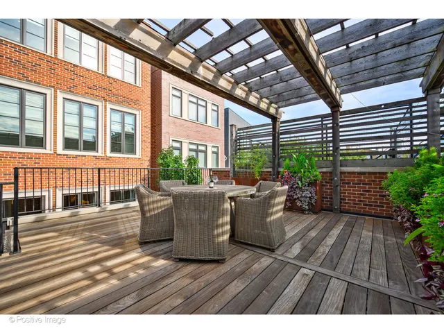 a view of a patio with couches and potted plants