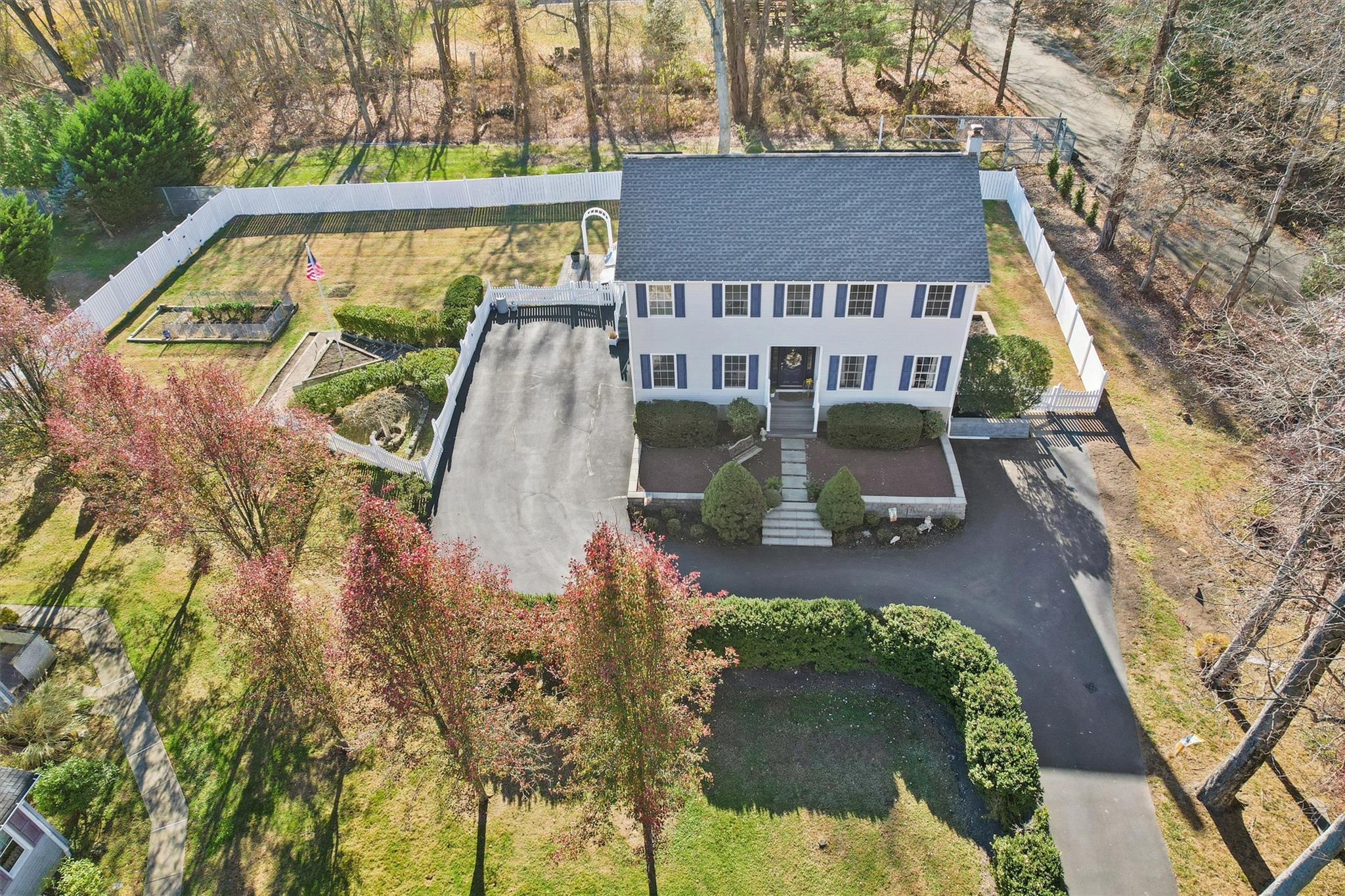 an aerial view of a house with swimming pool garden and patio