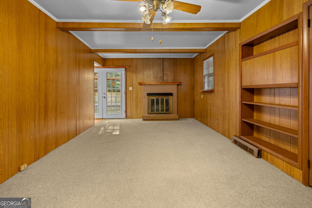 130 Club Drive Stockbridge, GA 30281 - Photo 12 of 28 a view of an empty room with a fireplace and a window