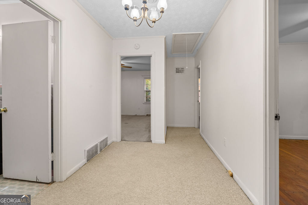 130 Club Drive Stockbridge, GA 30281 - Photo 14 of 28 an empty room with a hallway