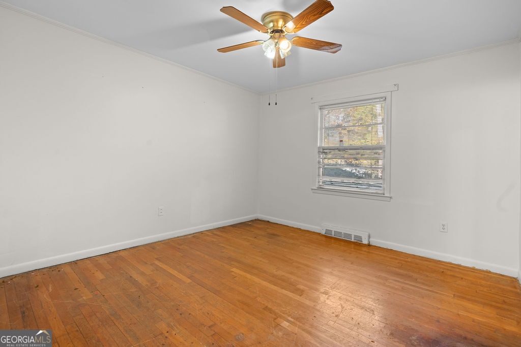 130 Club Drive Stockbridge, GA 30281 - Photo 18 of 28 an empty room with windows and fan