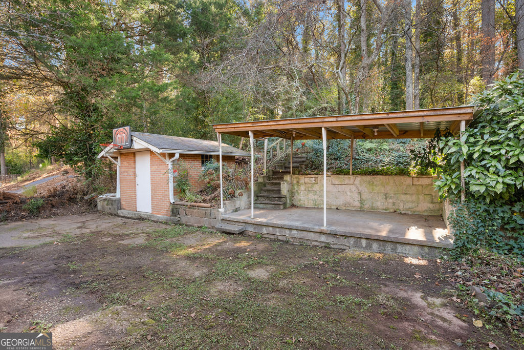 130 Club Drive Stockbridge, GA 30281 - Photo 27 of 28 a view of backyard with large tree and wooden fence