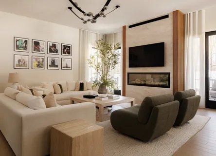 a living room with furniture flat screen tv and a fireplace