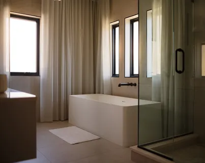 a bathroom with a bathtub and a shower