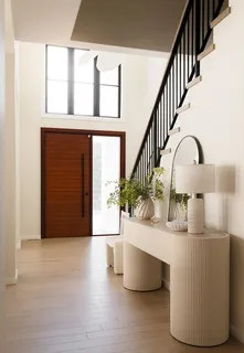 a view of entryway and hall with wooden floor